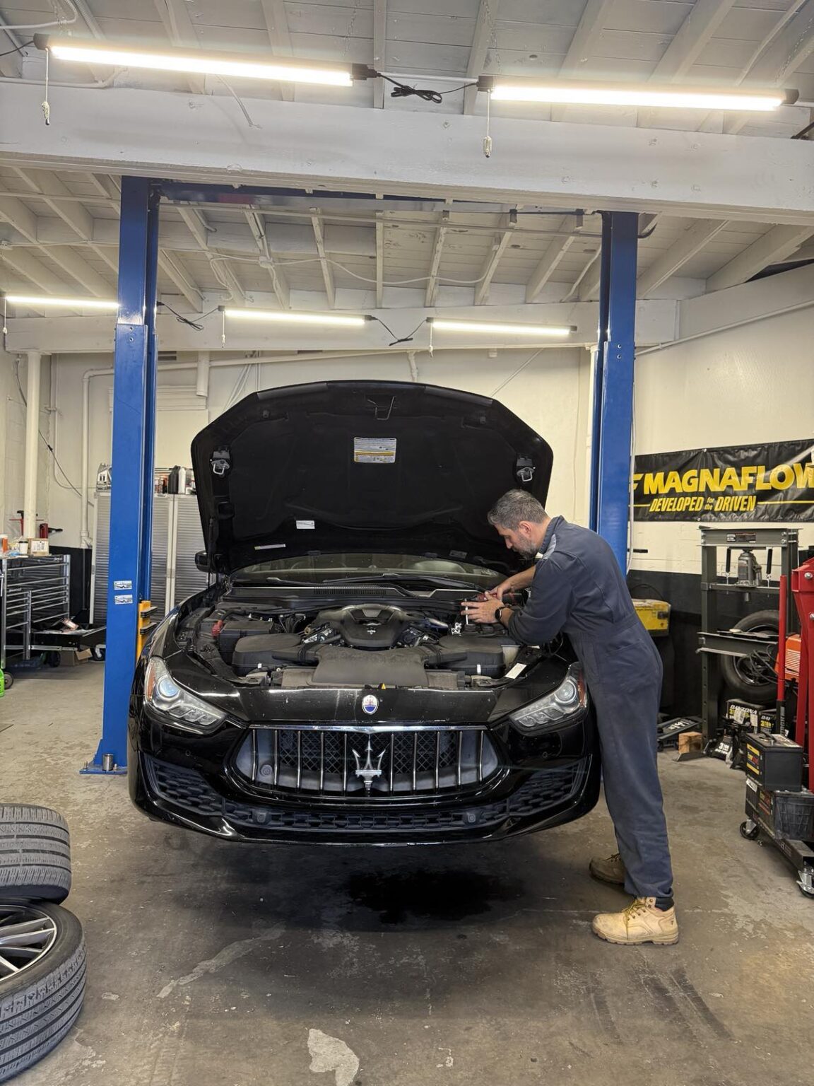 Bass inspecting a vehicle at Target Auto Repair