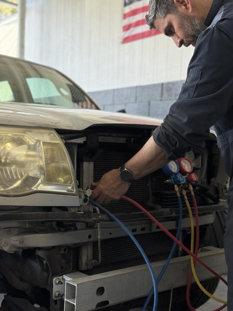 Bass working on a vehicle at Target Auto Repair